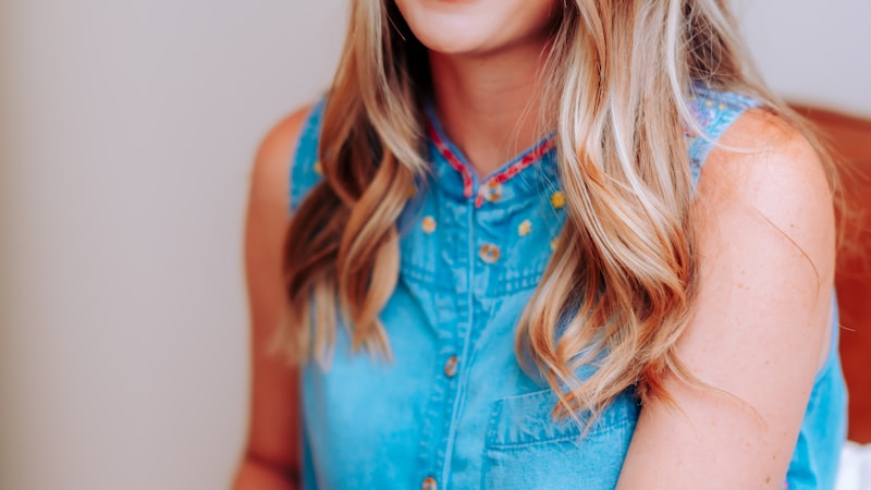 World Cup trophy displayed on pedestal with stadium in background
